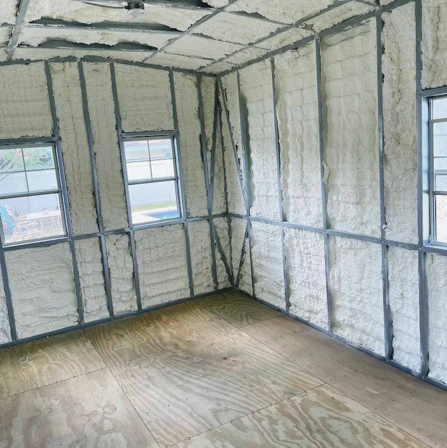 Closed-cell spray foam insulation applied to wall cavities in a residential project in Fairhope